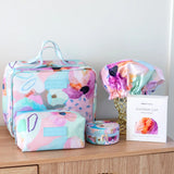 Coordinated set of cosmetic and toiletry bags in colourful design, by artist Jade Fisher