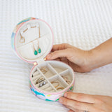 Travel jewellery case with adjustable compartments to avoid tangled necklaces, in colourful pastel design by Australian artist, Jade Fisher.