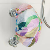 A colourful shower cap to keep your hair dry with design by artist Jade Fisher.