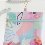 Hanging Toiletry Bag in design Fleur by artist Jade Fisher featuring hook
