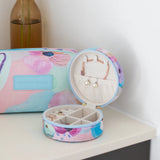 Travel jewellery case with adjustable compartments to avoid tangled necklaces, in colourful pastel design by Australian artist, Jade Fisher.