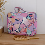 Hanging Toiletry Bag by Mindful Marlo in Willow design, closed sitting on counter top