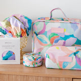 Coordinated set of cosmetic and toiletry bags in colourful design, by artist Jade Fisher