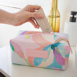 Spacious cosmetic makeup bag in box-shape, with colourful pastel design by Australian artist Jade fisher - from the Romy collection.